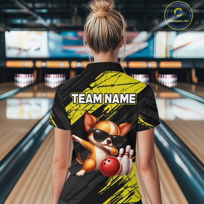 Person wearing a bowling shirt with a dog graphic and 'TEAM NAME' text in a bowling alley.