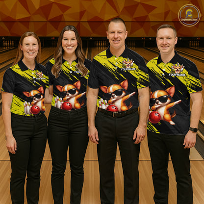Four people wearing matching bowling shirts with a dog design on a bowling alley.