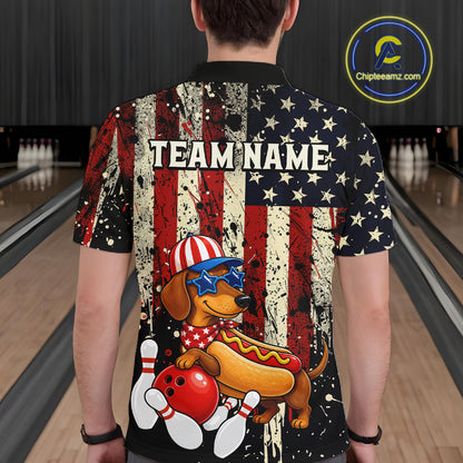 Person wearing a colorful shirt with a dog and hot dog design in a bowling alley.