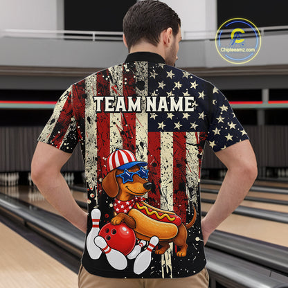 Man wearing a shirt with a dachshund hot dog graphic and 'TEAM NAME' text in a bowling alley.