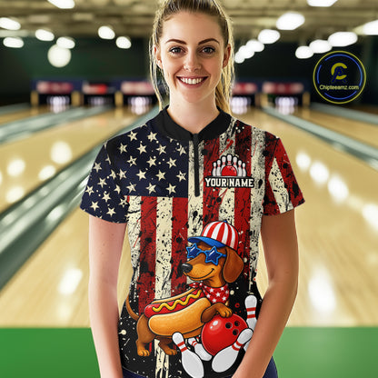 Person wearing a colorful bowling shirt with a dog design in a bowling alley.