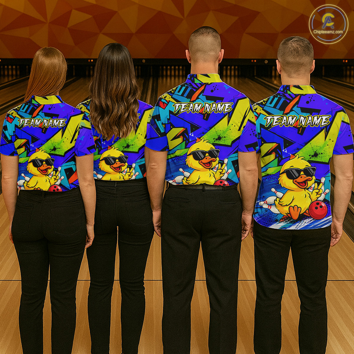 Four people wearing colorful bowling shirts with a duck design on a bowling alley.