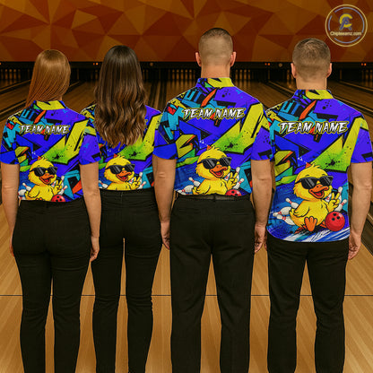 Four people wearing colorful bowling shirts with a duck design on a bowling alley.