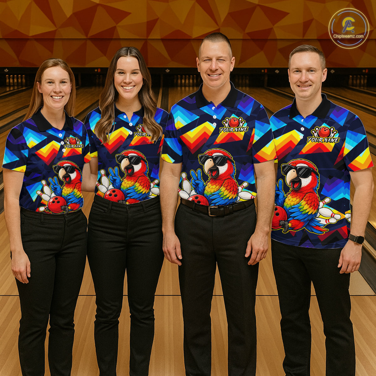 Four people standing together in a bowling alley wearing matching colorful bowling shirts with parrot graphics and black pants. A bowling lane and wooden pins are visible in the background.