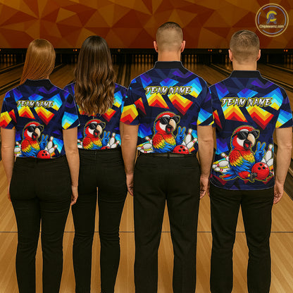 Four people standing with their backs to the camera in a bowling alley, wearing matching custom bowling shirts with a colorful parrot graphic and 'TEAM NAME' text. The shirts feature a blue, red, and yellow retro design.