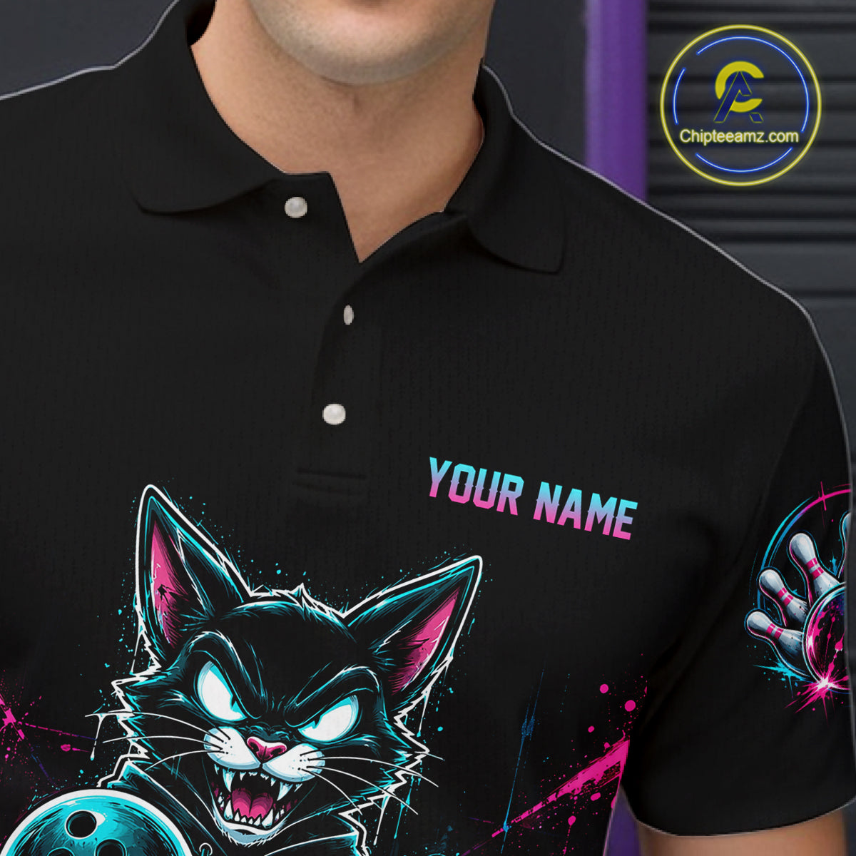 A close-up of a man wearing a black short-sleeve polo shirt with a colorful graphic of a cartoon cat holding a bowling ball, the text 'YOUR NAME' on the chest, and a bowling pin graphic on the sleeve. A circular 'Chiplearnz.