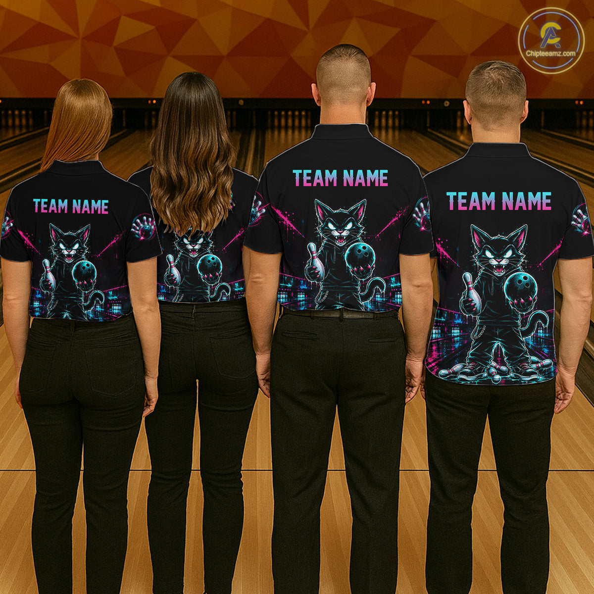 Four people standing from the back in a bowling alley, wearing matching black short-sleeve bowling shirts with a colorful cat graphic and 'TEAM NAME' text on the back.