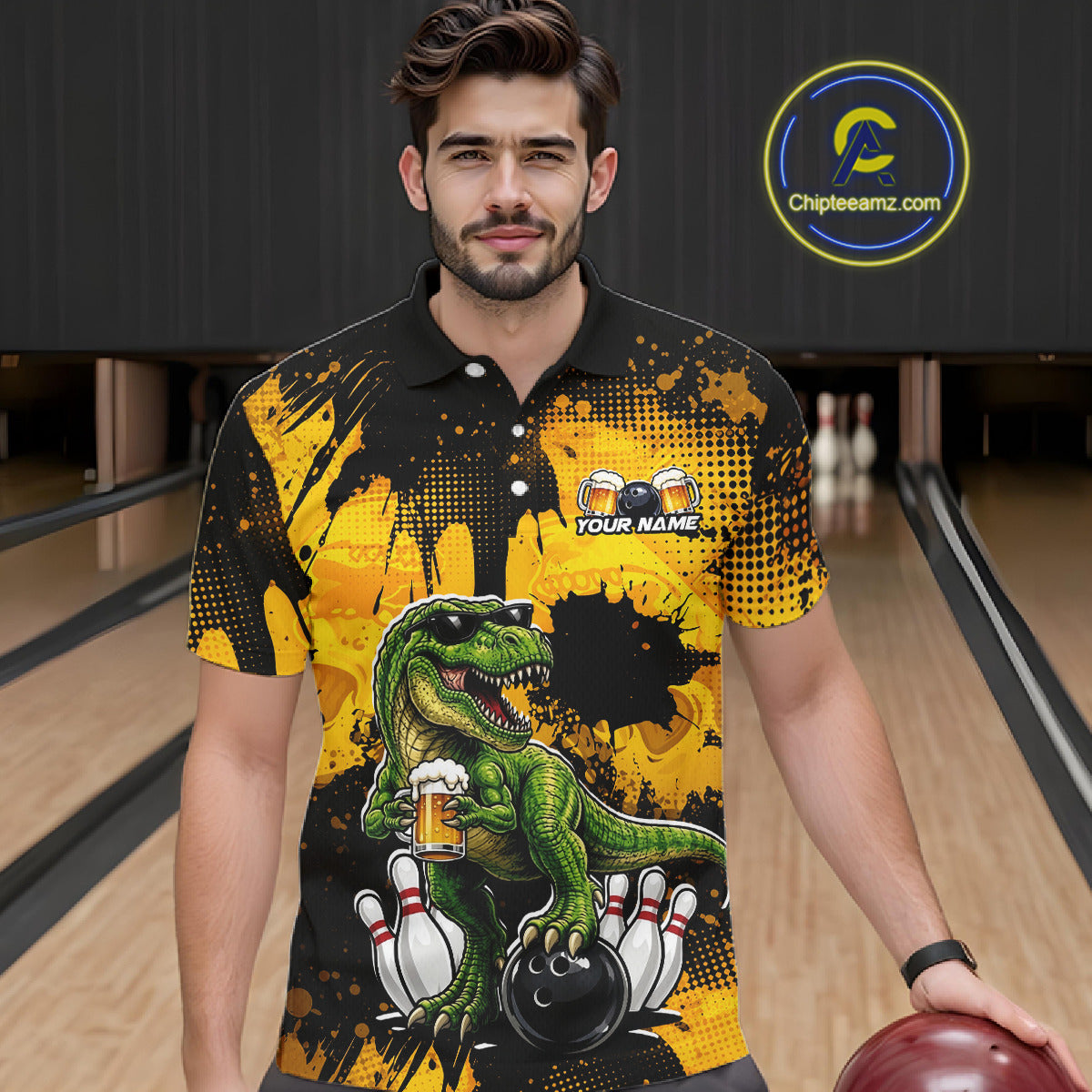 Man wearing a black bowling polo featuring a green T-Rex wearing sunglasses, holding a beer mug, standing with bowling pins and a bowling ball, plus personalized name and team name text.