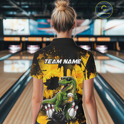 Women wearing bowling quarter zip shirt featuring a dinosaur holding beer with bowling pins and ball artwork on black yellow background.