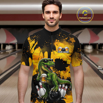 Man wearing a black bowling quarter zip featuring a green T-Rex wearing sunglasses, holding a beer mug, standing with bowling pins and a bowling ball, plus personalized name and team name text.