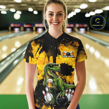 Women wearing bowling quarter zip shirt featuring a dinosaur holding beer with bowling pins and ball artwork on black yellow background.