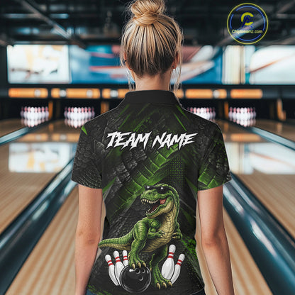 Women wearing bowling polo shirt featuring a dinosaur standing among bowling pins and ball artwork on black green textured background.