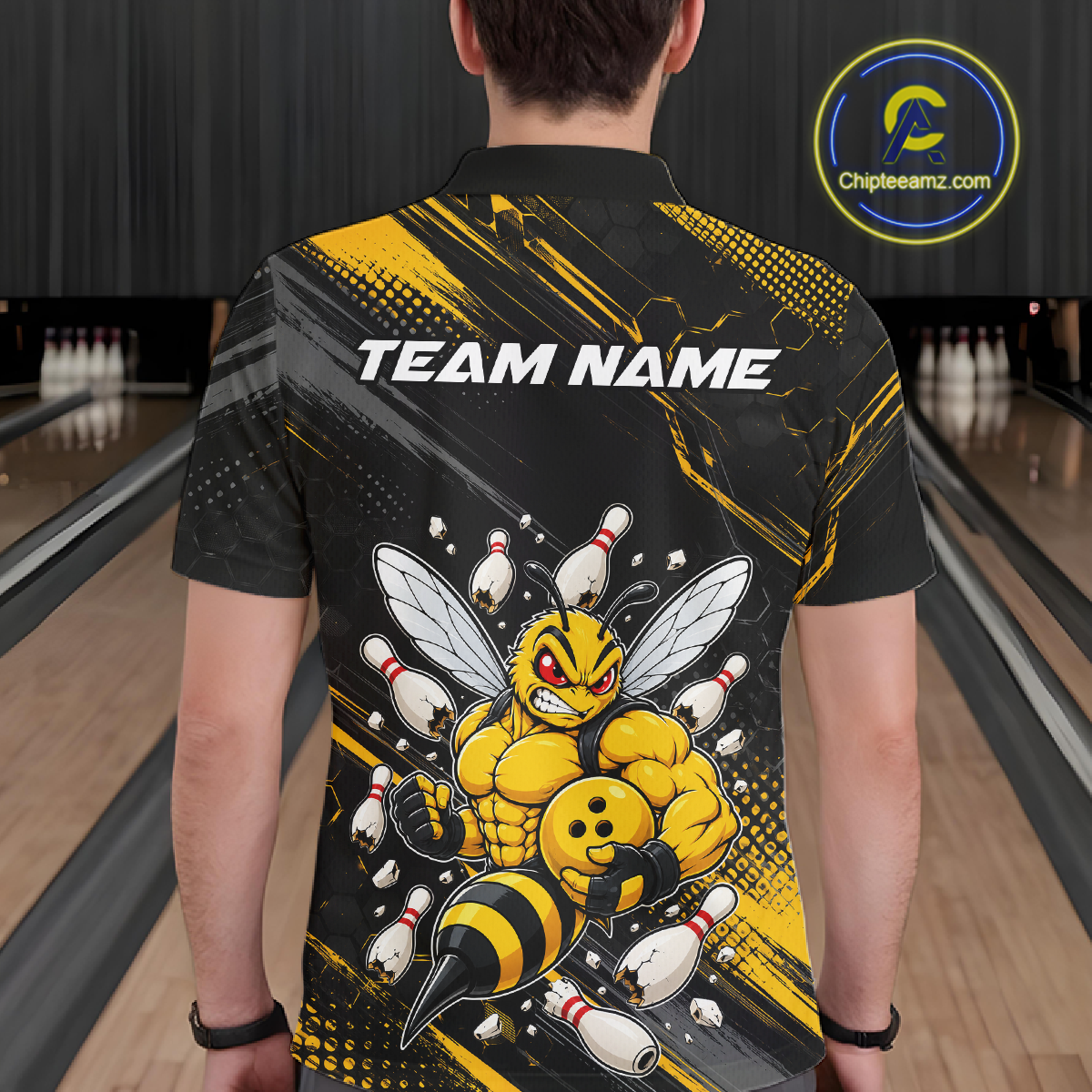 Man wearing bowling polo shirt featuring a muscular bee holding a bowling ball surrounded by pins on black yellow background.