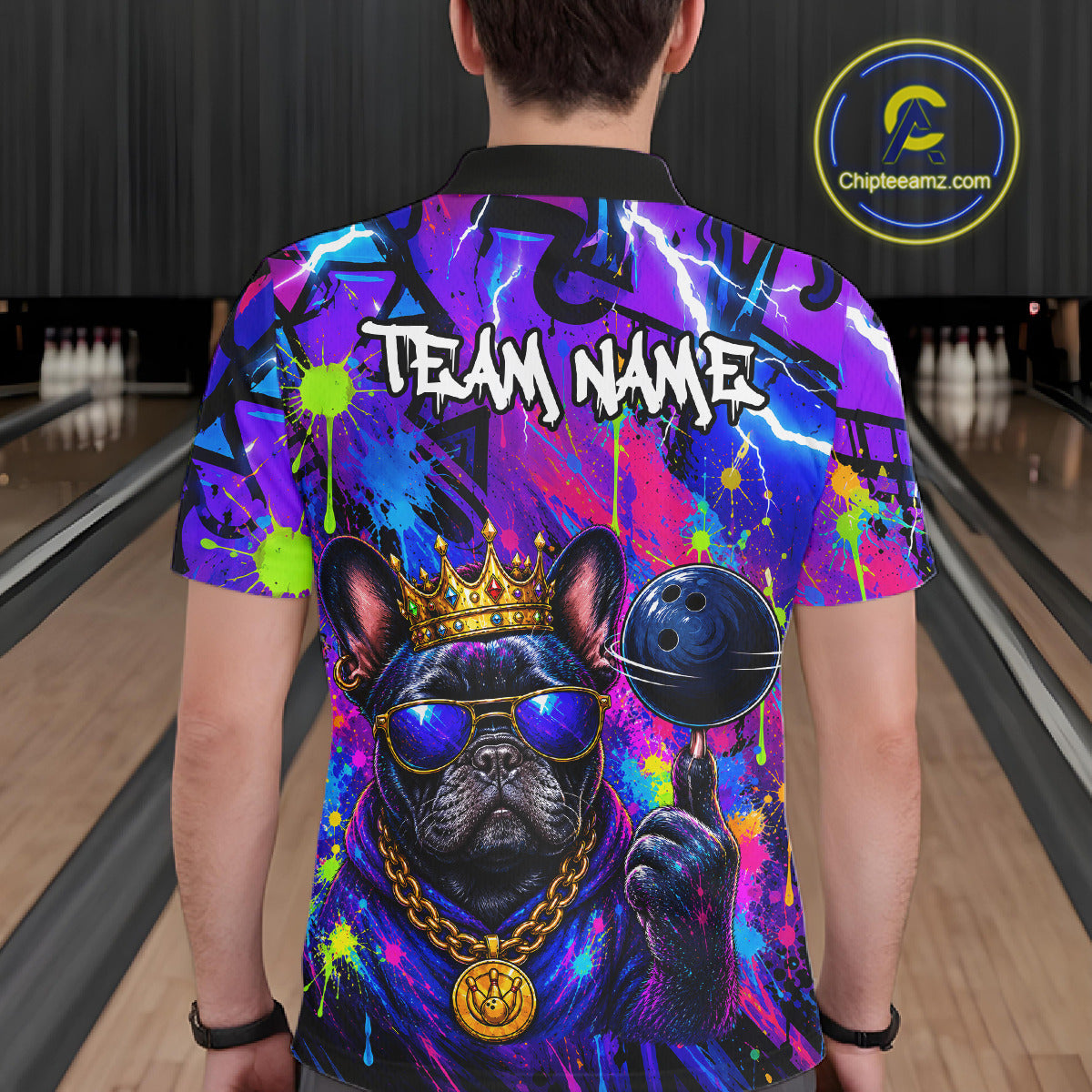 Men wearing personalized bowling polo shirt with a crowned bulldog holding a bowling ball, surrounded by paint effects and bold graphic patterns.