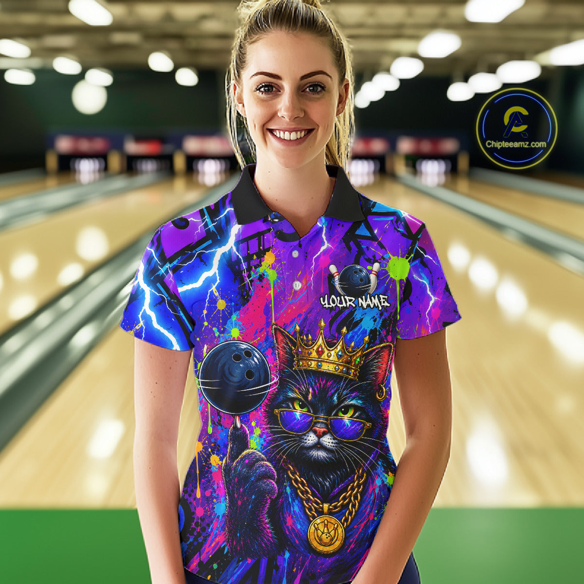 Women wearing personalized bowling polo shirt with a crowned cat holding a bowling ball, blended with colorful paint strokes and graphic patterns.