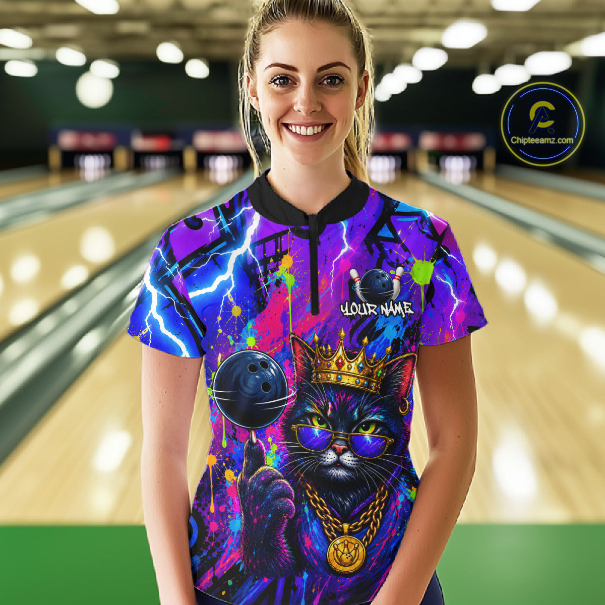 Women wearing personalized bowling quarter zip shirt with a crowned cat holding a bowling ball, blended with colorful paint strokes and graphic patterns.