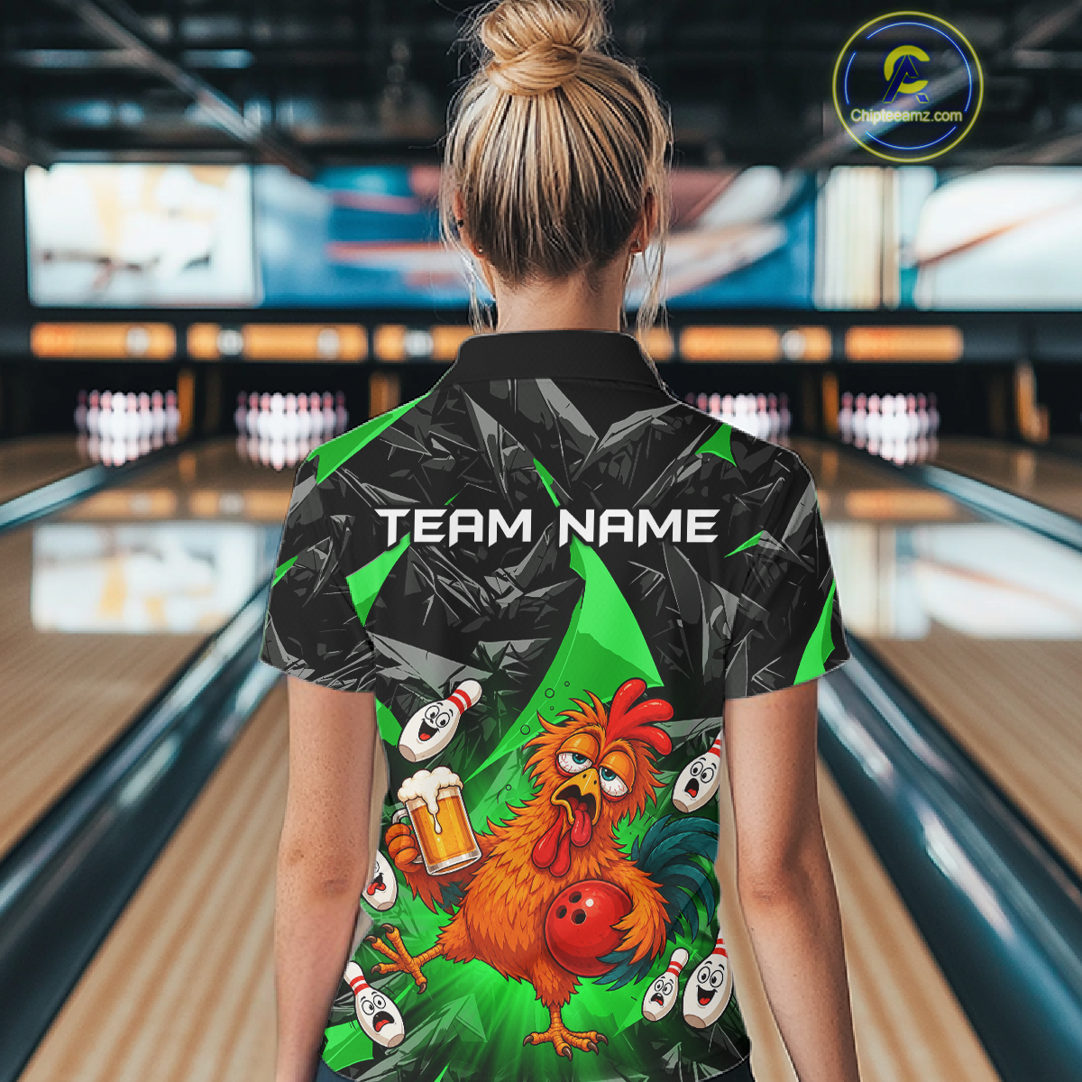 Woman wearing a black and green bowling quarter zip featuring a wild rooster mascot holding a beer mug and red bowling ball, with custom team name text.
