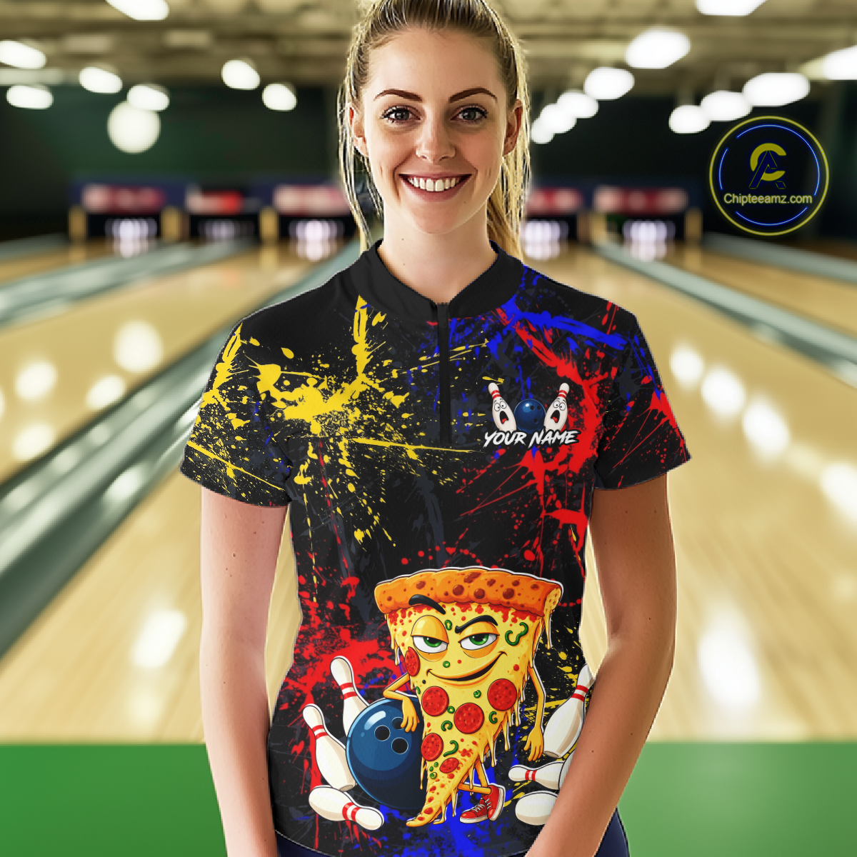 Woman wearing a black bowling quarter zip featuring colorful red, yellow, and blue paint splatter graphics, a cartoon pizza slice mascot, bowling pins, and custom your name text.
