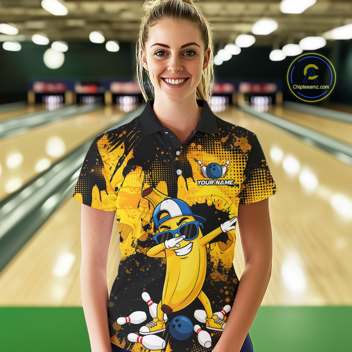 Woman wearing a black and yellow bowling polo featuring a cool banana mascot dabbing, bowling pins, a blue bowling ball, and custom your name text.