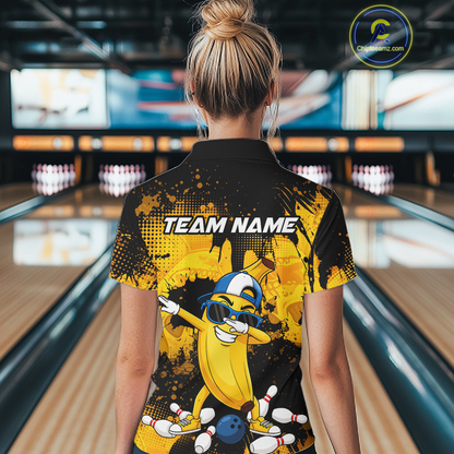 Woman wearing a black and yellow bowling polo featuring a cool banana mascot dabbing, bowling pins, a blue bowling ball, and custom team name text.