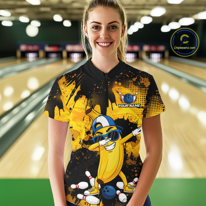 Woman wearing a black and yellow bowling quarter zip featuring a cool banana mascot dabbing, bowling pins, a blue bowling ball, and custom your name text.