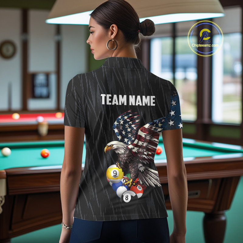 Woman wearing a black t-shirt with an eagle design and 'TEAM NAME' text in a pool hall.