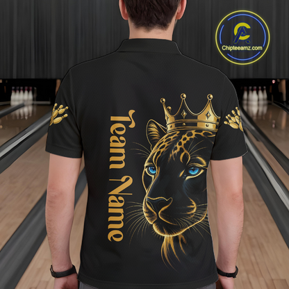 Person wearing a black t-shirt with a gold leopard design and 'Team Name' text in a bowling alley.