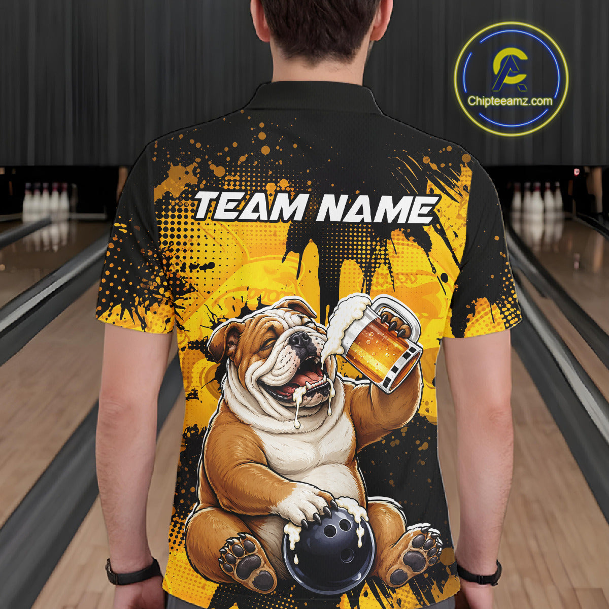 Person wearing a bowling-themed shirt with a bulldog graphic and 'Team Name' text in a bowling alley.