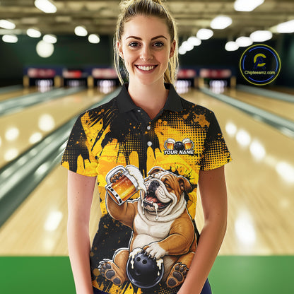 Person wearing a bowling shirt with a bulldog design in a bowling alley.