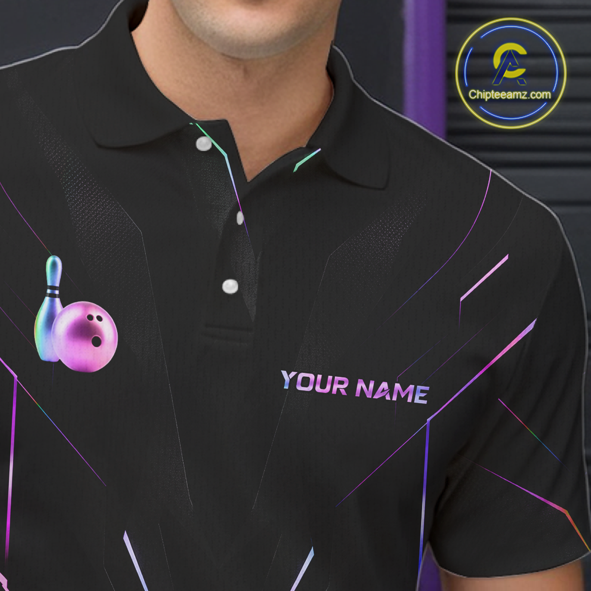Black polo shirt with colorful bowling ball and pin design on a person, brand logo visible.