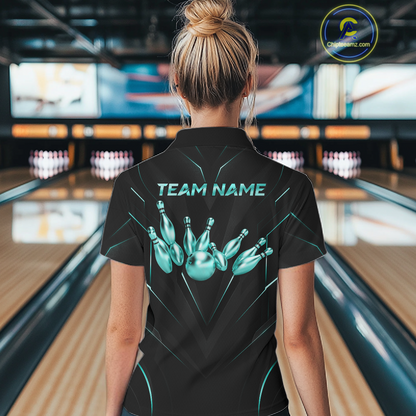 Person wearing a black bowling shirt with 'TEAM NAME' and bowling pin design in a bowling alley.