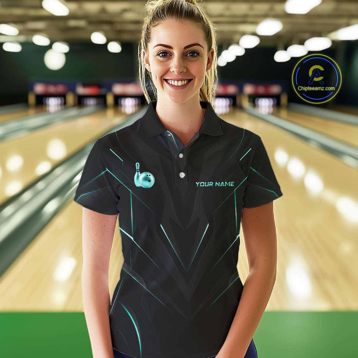 Woman wearing a black bowling shirt with gold accents in a bowling alley.
