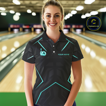Load image into Gallery viewer, Woman wearing a black bowling shirt with teal accents in a bowling alley.