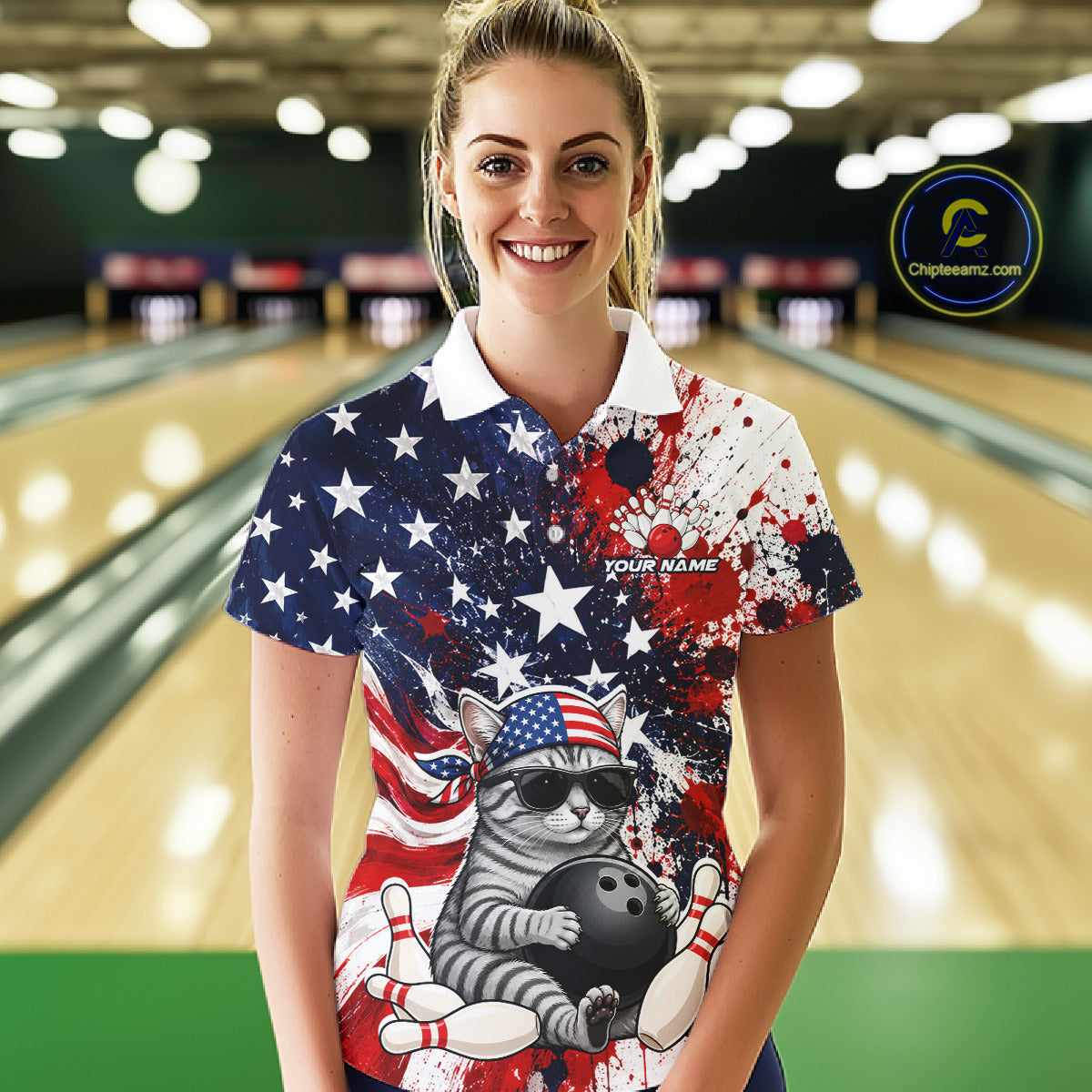 Woman wearing a colorful bowling shirt with a cat design in a bowling alley.