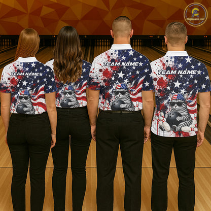 Four people wearing matching bowling shirts with a patriotic design on a bowling alley.