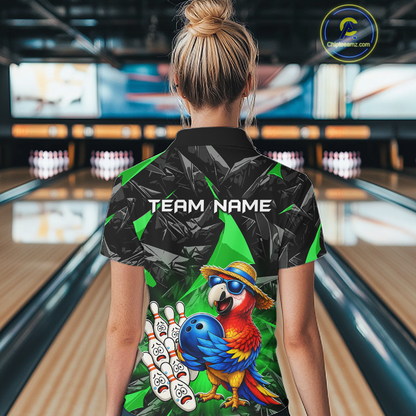 Person wearing a colorful bowling shirt with a parrot design in a bowling alley.