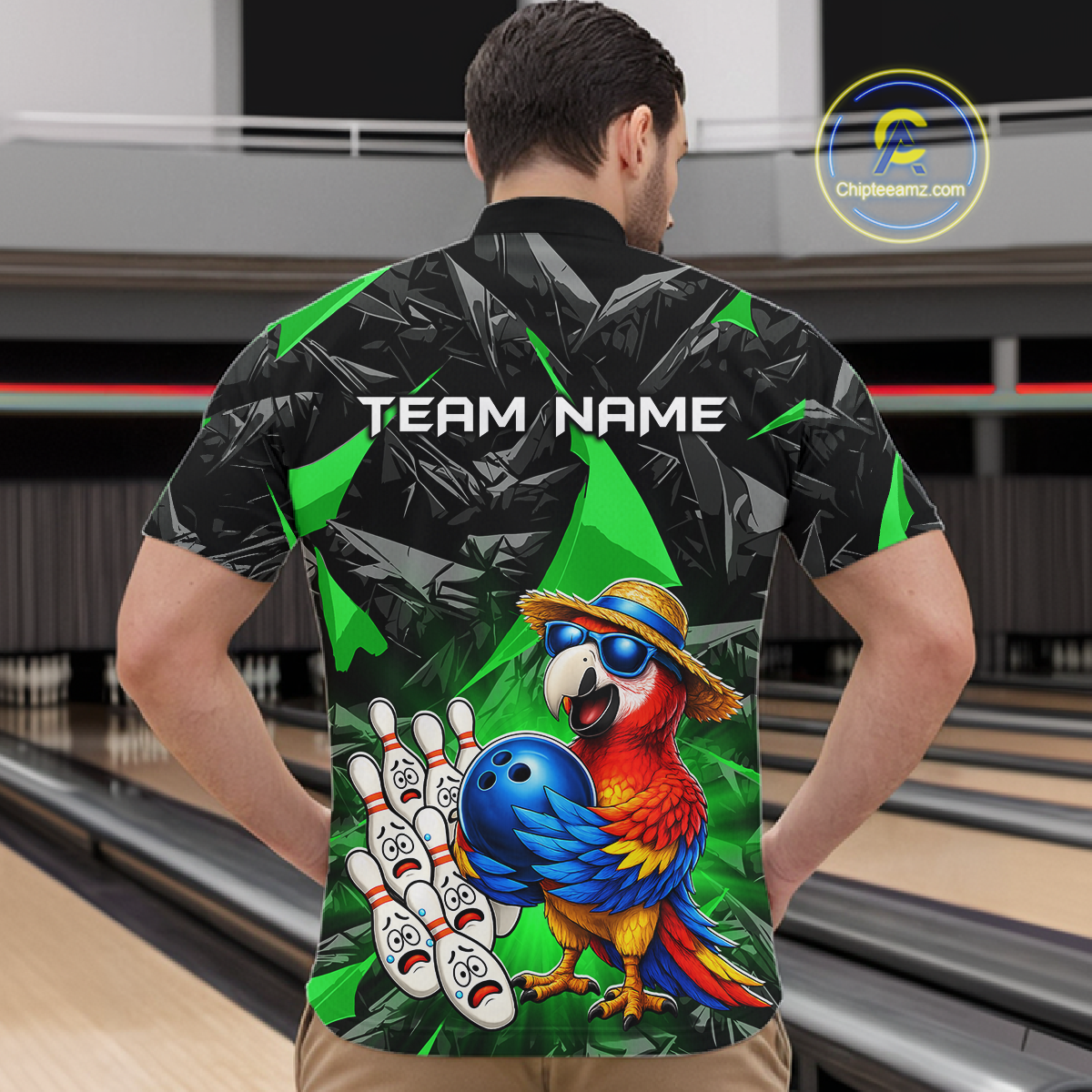 Man wearing a colorful bowling shirt with a parrot design at a bowling alley.