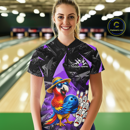 Person wearing a bowling shirt with a parrot design in a bowling alley.