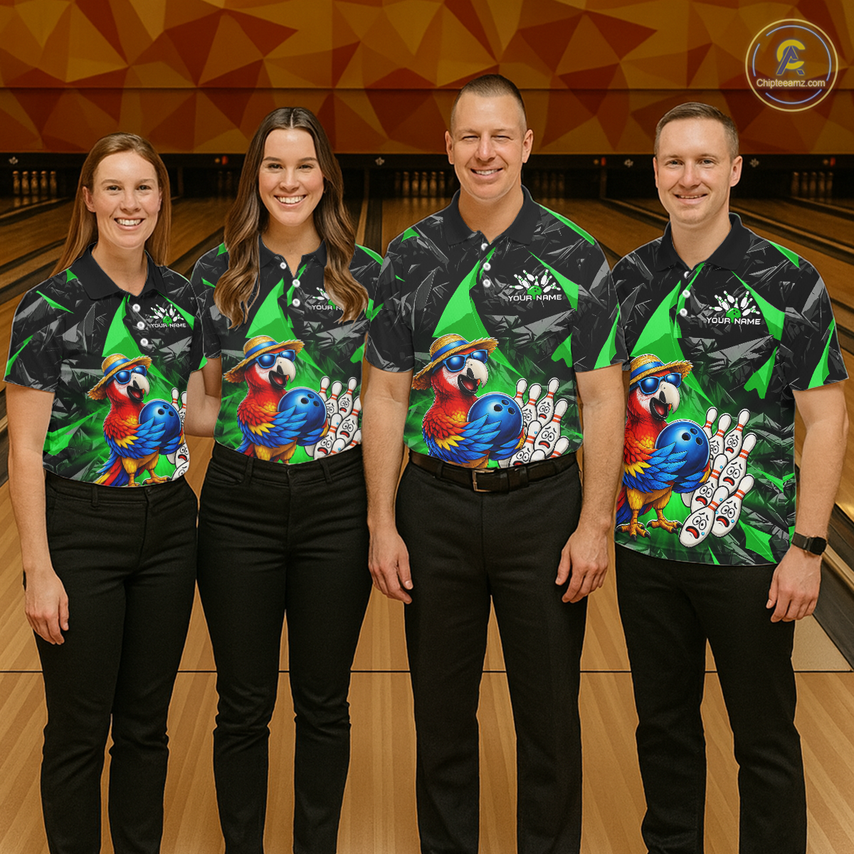 Four people wearing matching bowling shirts with colorful parrot designs on a bowling alley.