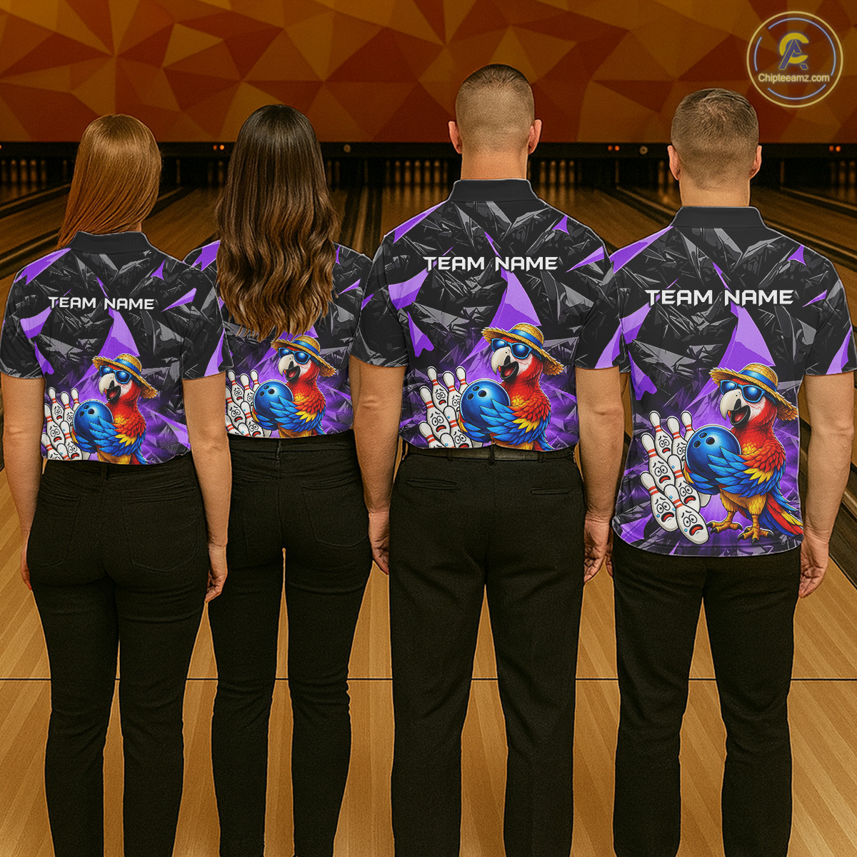 Four people wearing matching bowling shirts with colorful parrot designs on a bowling alley.