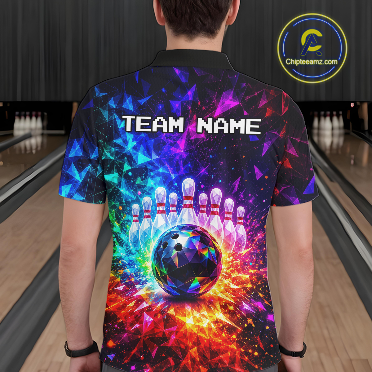 Person wearing a colorful bowling shirt with a design and 'TEAM NAME' text in a bowling alley.