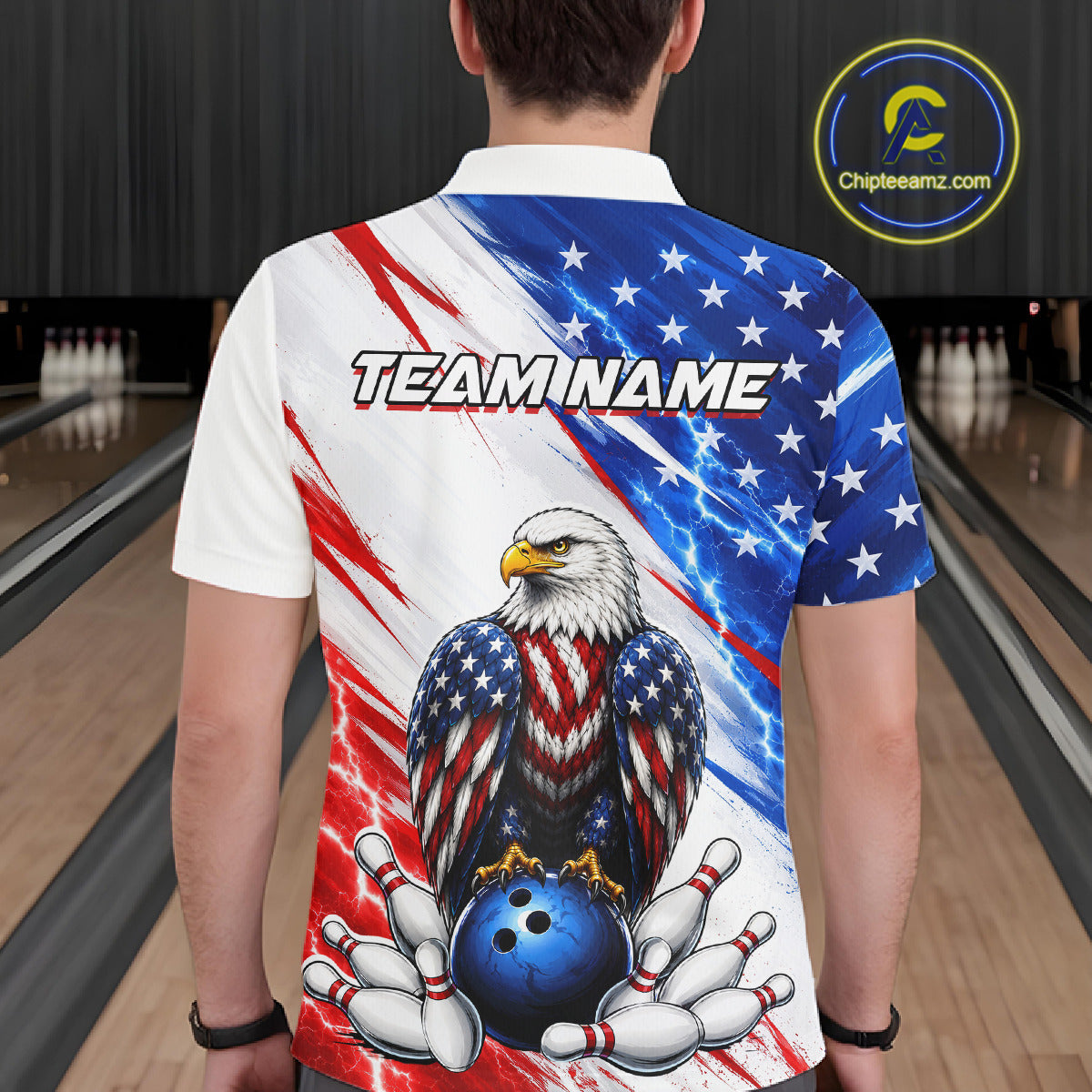 Person wearing a bowling shirt with an eagle design and 'TEAMNAME' text in a bowling alley.