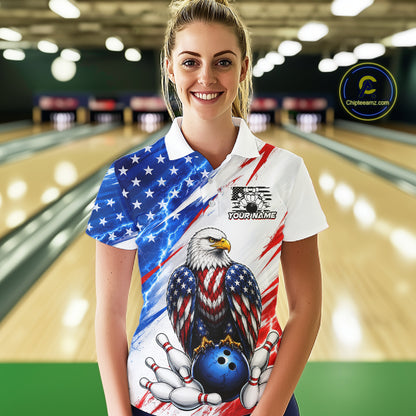 Woman wearing a patriotic bowling shirt with an eagle design in a bowling alley.