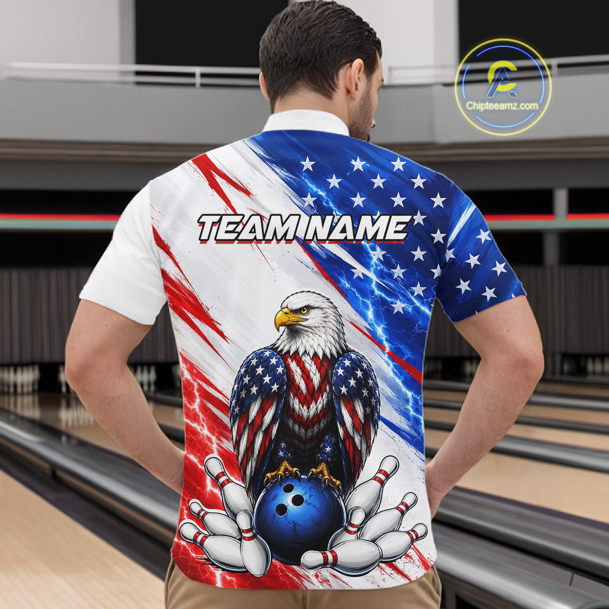 Man wearing a bowling shirt with American flag design and eagle graphic in a bowling alley.