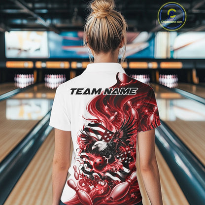 Back view of a female model at the bowling lane wearing a white and red bowling polo shirt with eagle and flag inspired artwork.