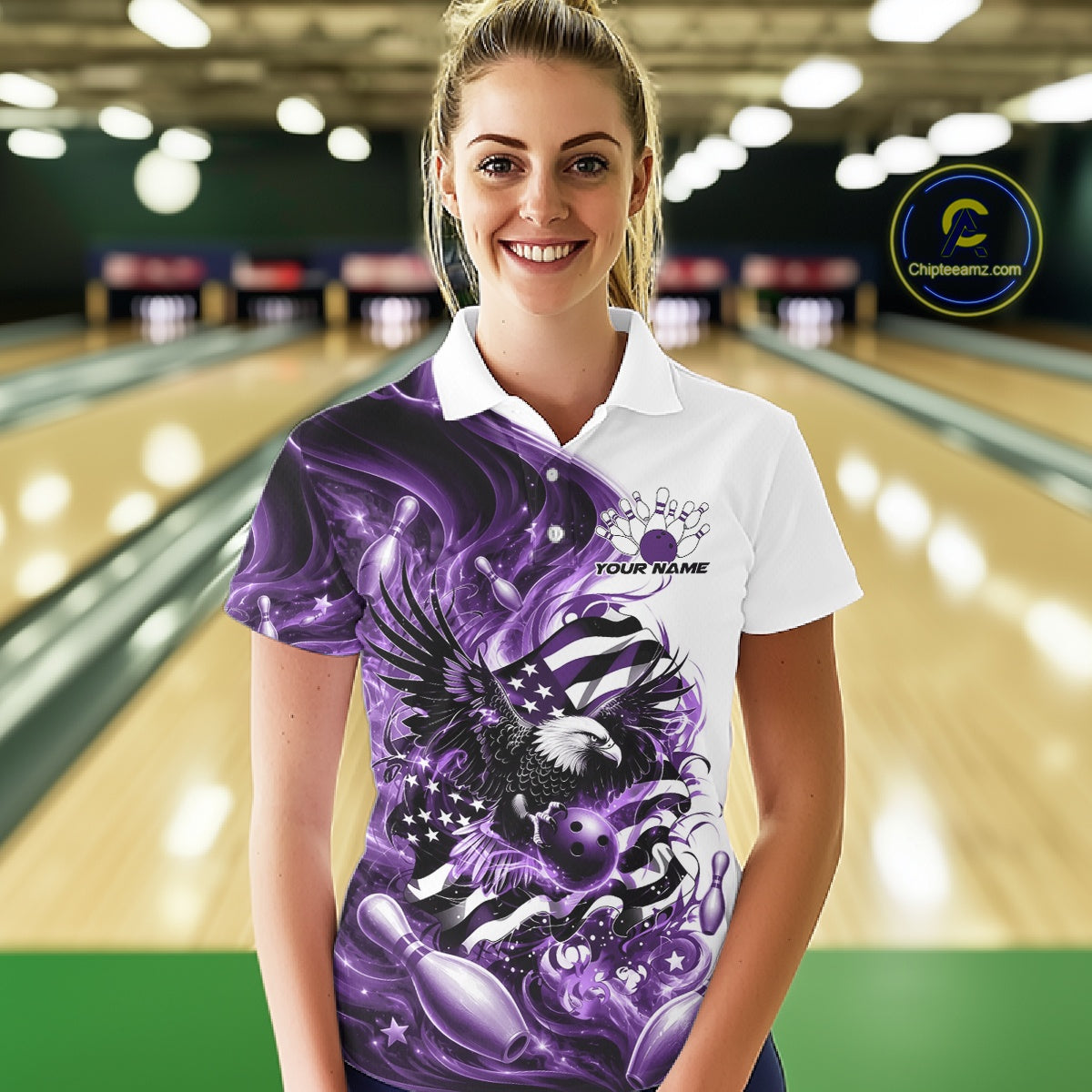 Front view female model at the bowling lane wearing a white and purple bowling polo shirt with eagle artwork and flag inspired graphics.