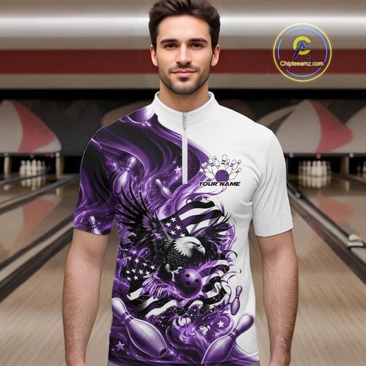 Front view of a male model in a bowling lane wearing a white and purple quarter zip shirt with eagle graphics and flowing flag inspired artwork.
