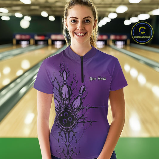 Woman wearing a purple bowling shirt with a design and 'Your Name' text in a bowling alley.