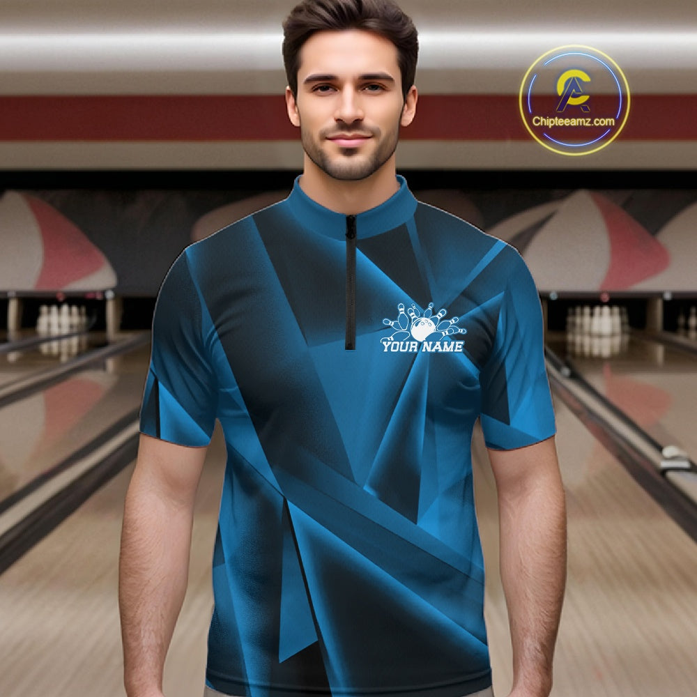 Man wearing a blue bowling shirt with a personalized design in a bowling alley.
