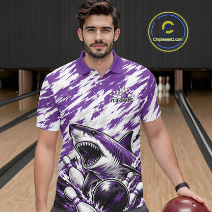 Man wearing a purple and white polo shirt with a shark design in a bowling alley.